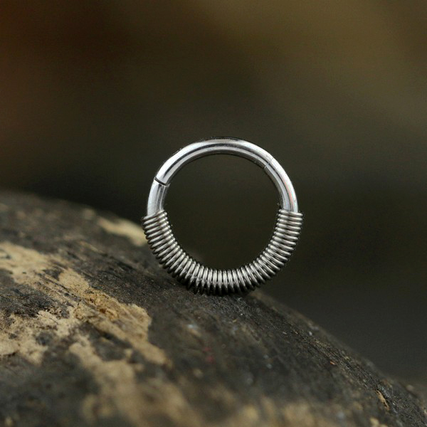 hinged segment ring piercing,industrial piercing,snug piercing,tragus piercing,nose piercing,eyebrow piercing