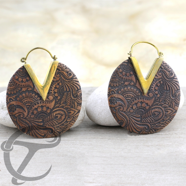 A tribal brass earring with a balinese inspired motif makes this wood earring a nice addition to our wholesale wood jewelry collection.
